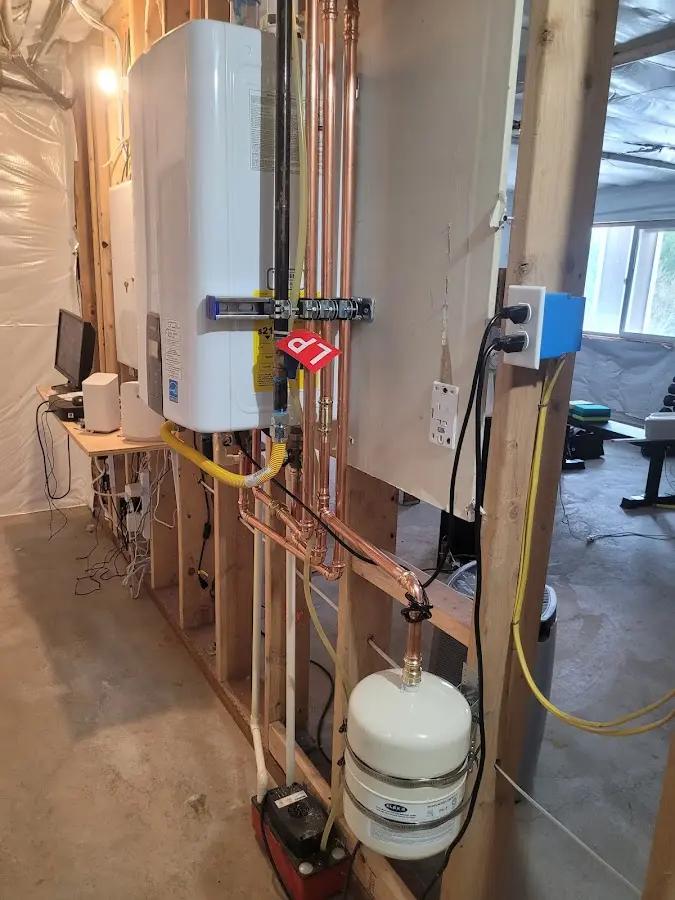 Licensed plumber repairing a kitchen sink in Bartlesville